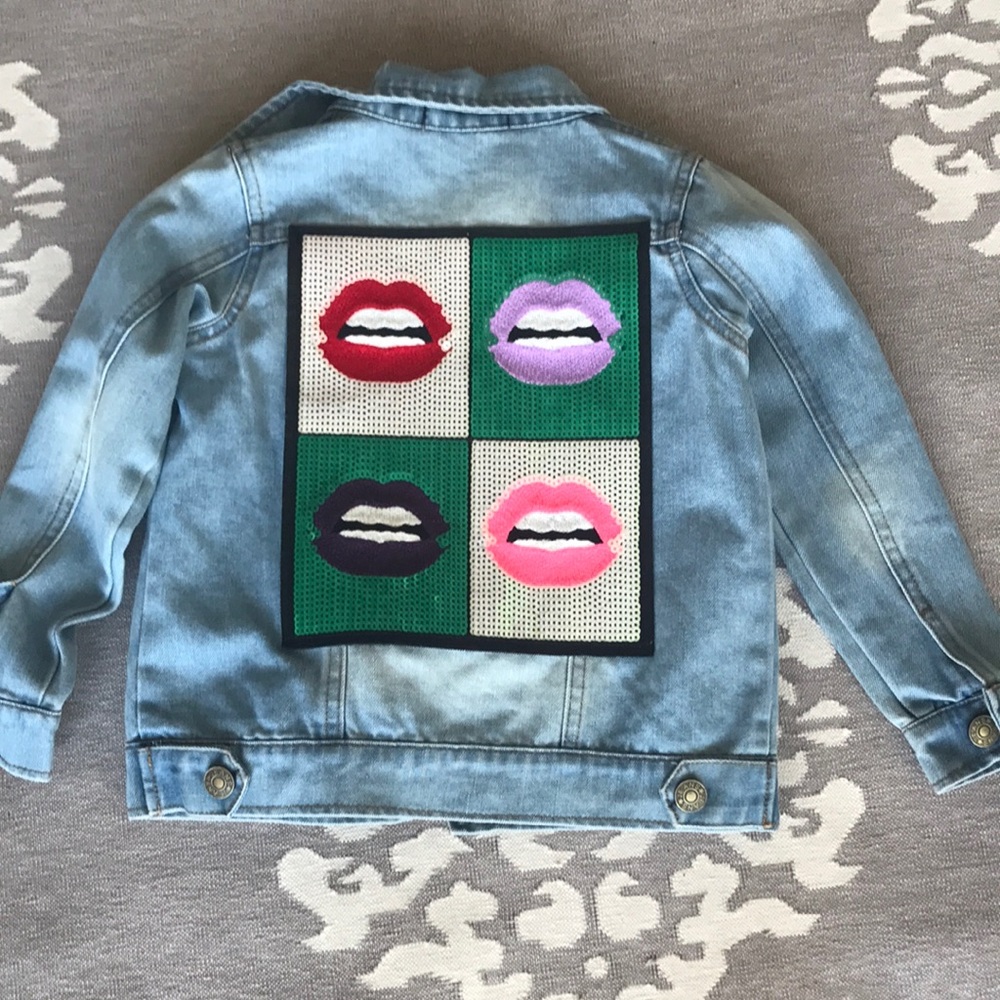 Girls Jean jacket with sequin design on back.
